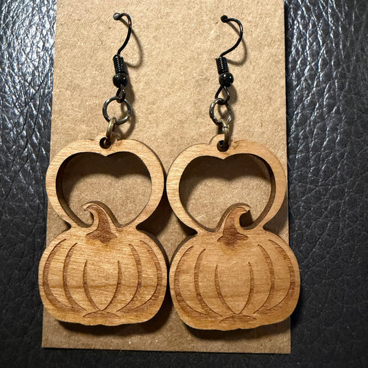 Pumpkin shaped wood earrings shown from another angle