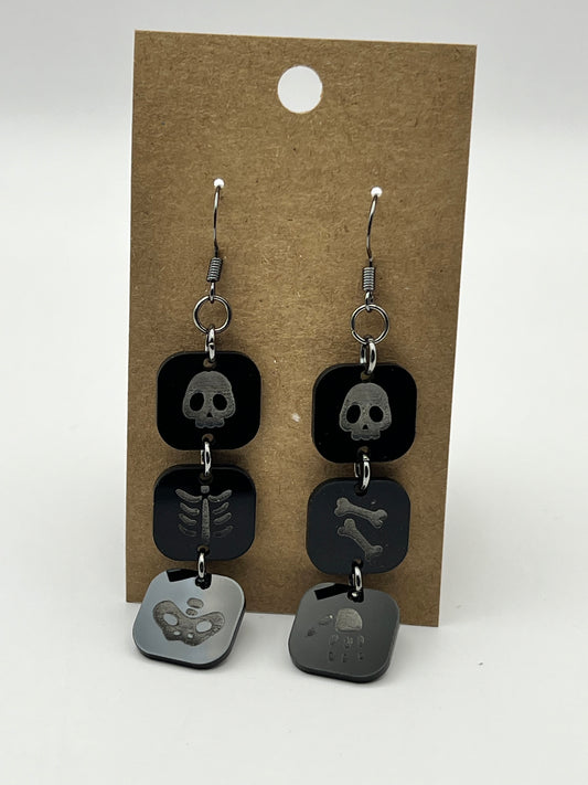 Black acrylic three-section dangling skeleton earrings