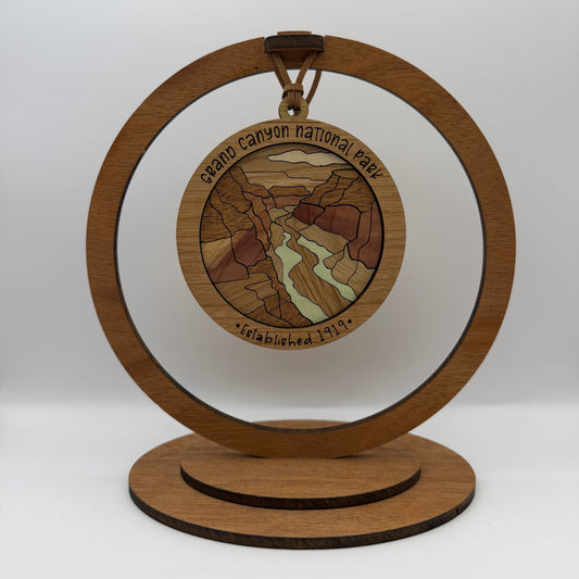 Inlaid wood Grand Canyon National Park ornament shown in a display stand