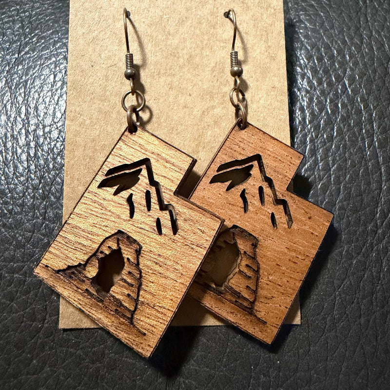 Utah shaped earrings with engraved arch and cut out mountain in mahogany wood