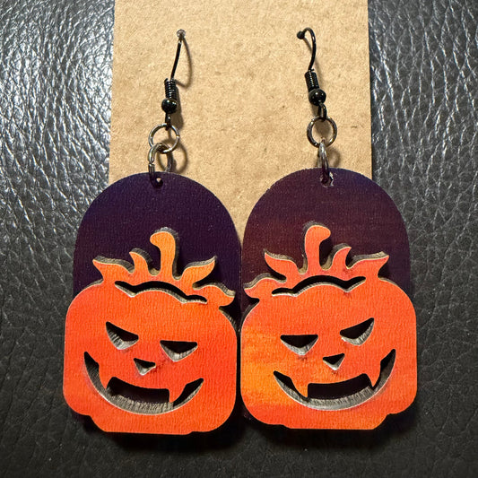 Tombstone with jack-o-lantern earrings shown from another angle
