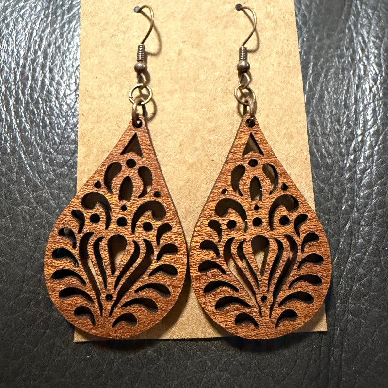 Close-up detail of teardrop cut wood earrings