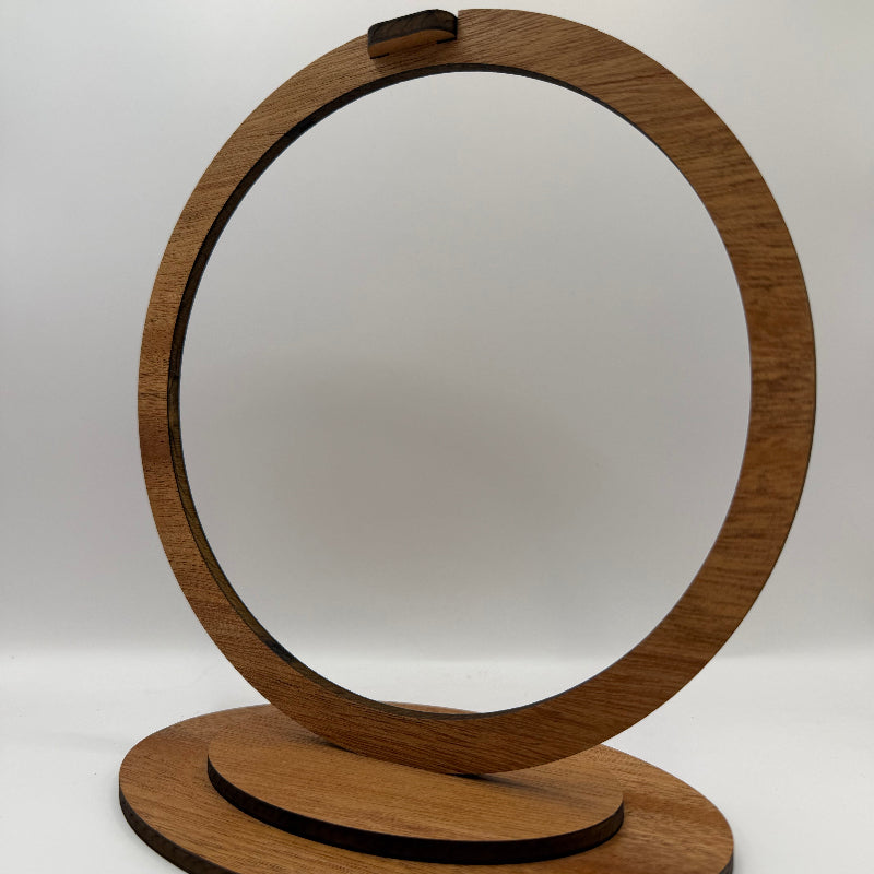 a round wooden ornament stand made of mahogany plywood