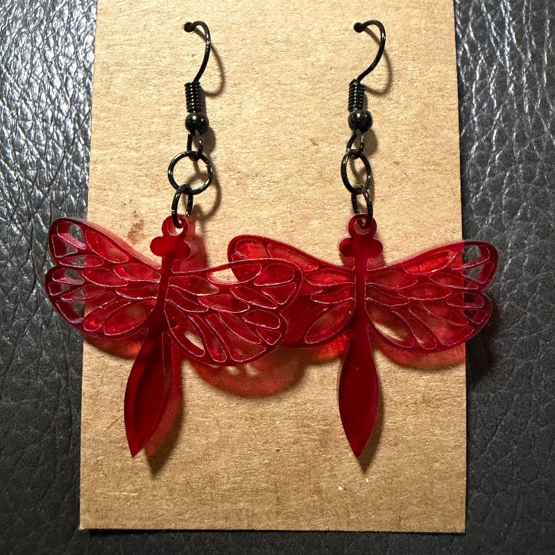 Acrylic dragonfly earrings displayed as a pair