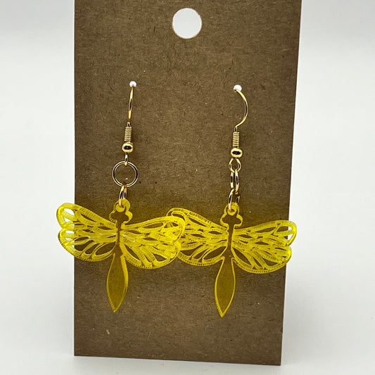 Close-up of acrylic dragonfly earring showing iridescent shimmer