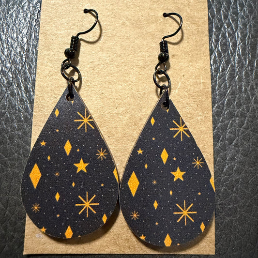 Orange stars UV printed earrings shown from another angle