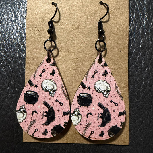 Cauldron and skull UV printed earrings shown from another angle
