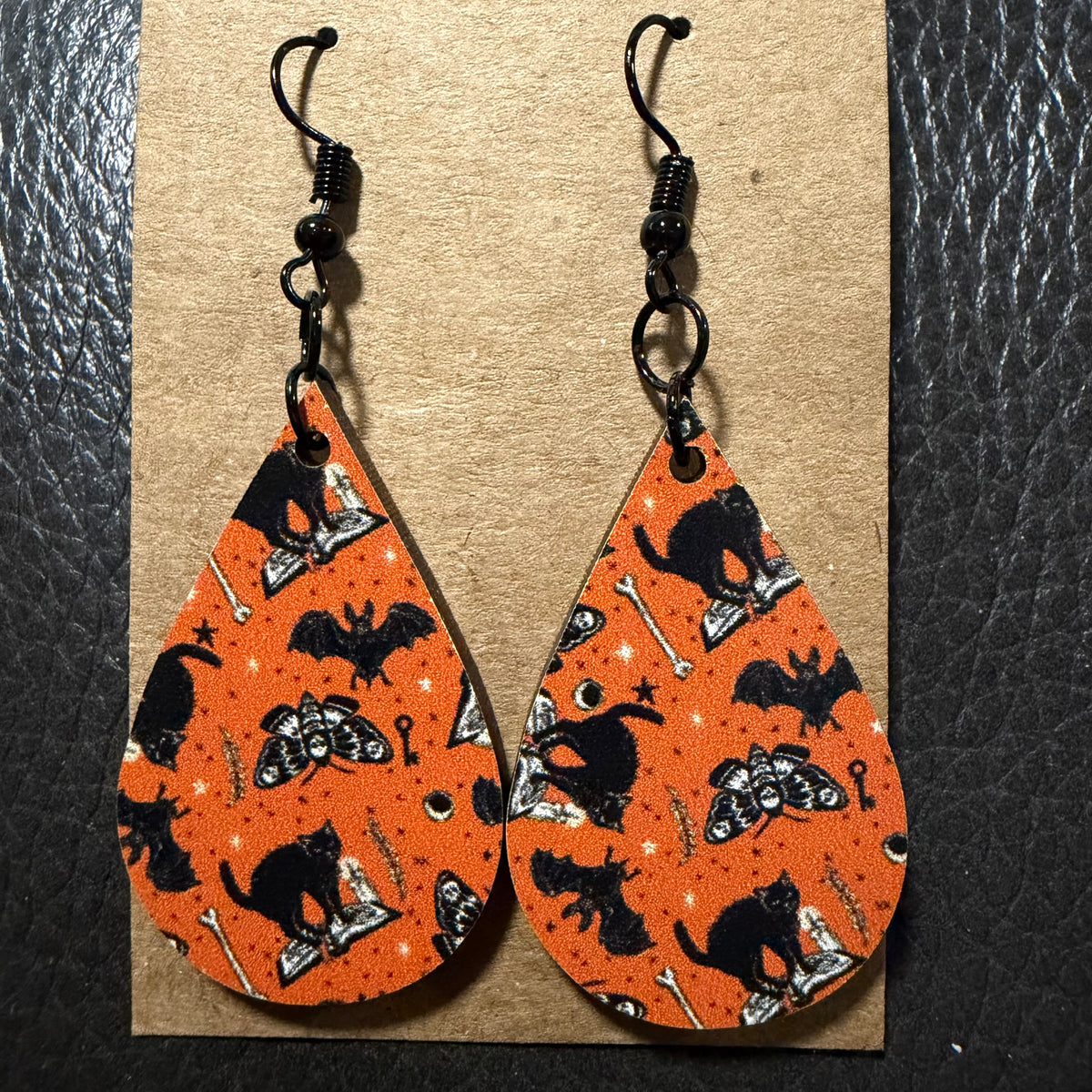 Black cats and bats UV printed earrings shown from another angle