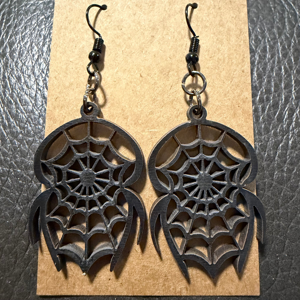 Small spider Halloween earrings shown from another angle