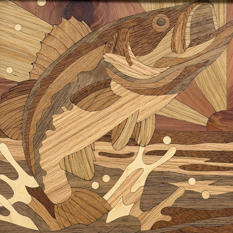 Intricately carved wooden inlay artwork depicting a jumping fish with layered natural wood grain patterns in various shades of brown, tan, and beige.