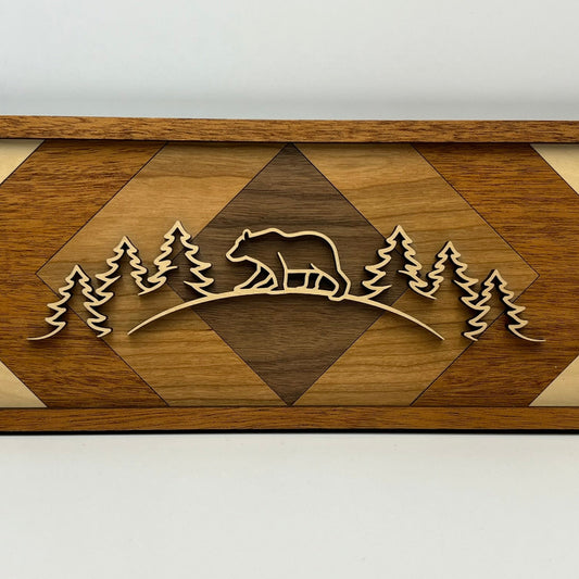 Handmade line art wall decor featuring a bear design over inlaid wood background