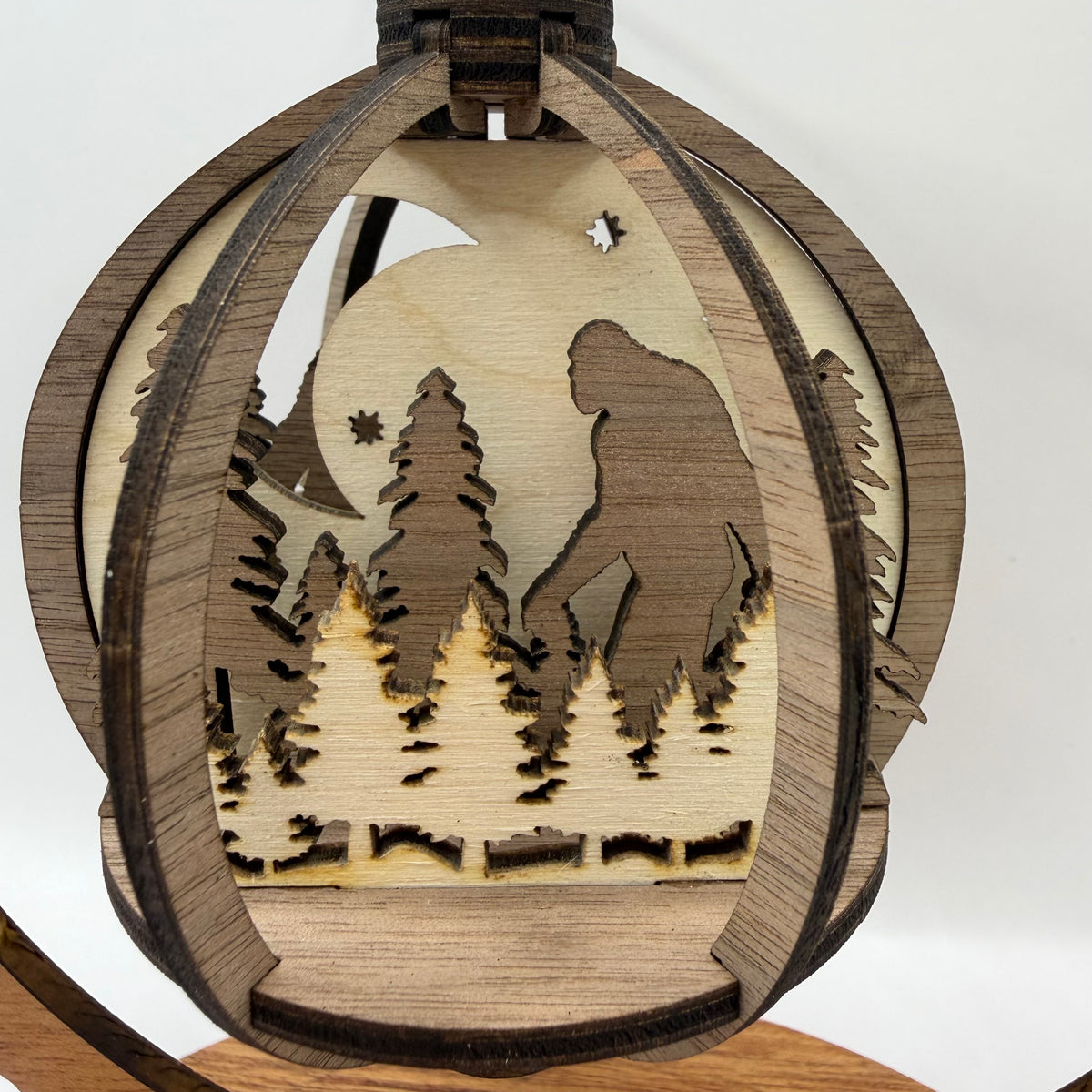 Close-up of the 3D Bigfoot Trees wood ornament
