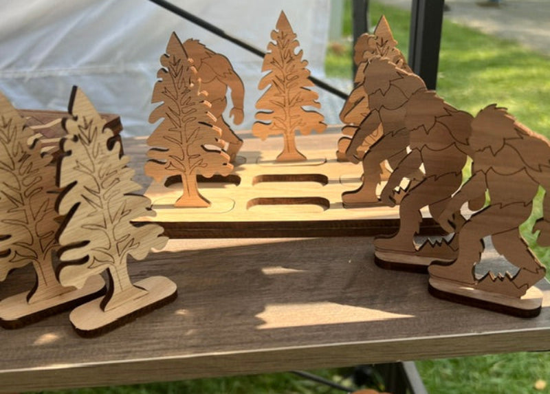 Wooden laser-cut bigfoot and trees themed tic tac toe game