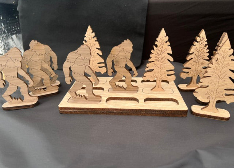 Wooden laser-cut models of a Bigfoot and trees tic tac toe game