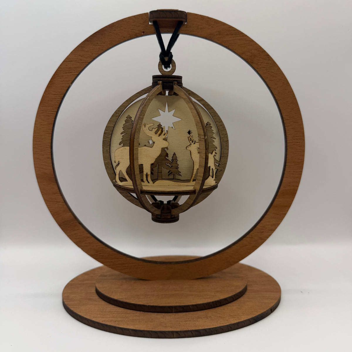 3D Deer wood ornament shown in a display stand