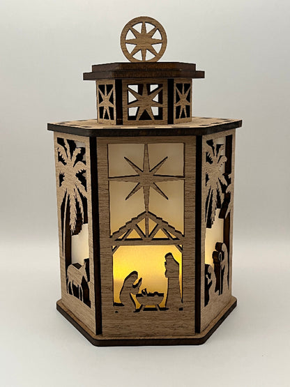 Full view of the lit 6-sided Nativity lantern showing all sides glowing