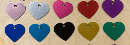 10 colors of heart shaped dog tags hanging on small nails
