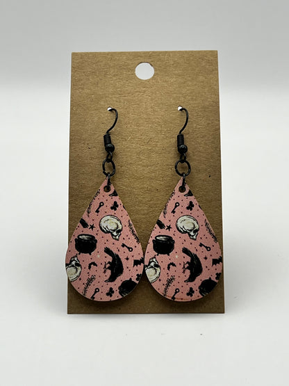 Pink teardrop earrings with UV printed cauldron, raven, and skull design
