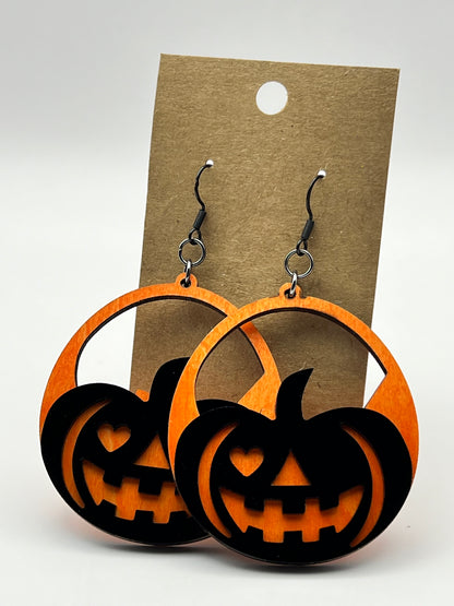 Orange and black laser-cut wood jack-o'-lantern earrings