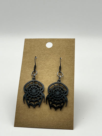 Small black acrylic spider-shaped earrings