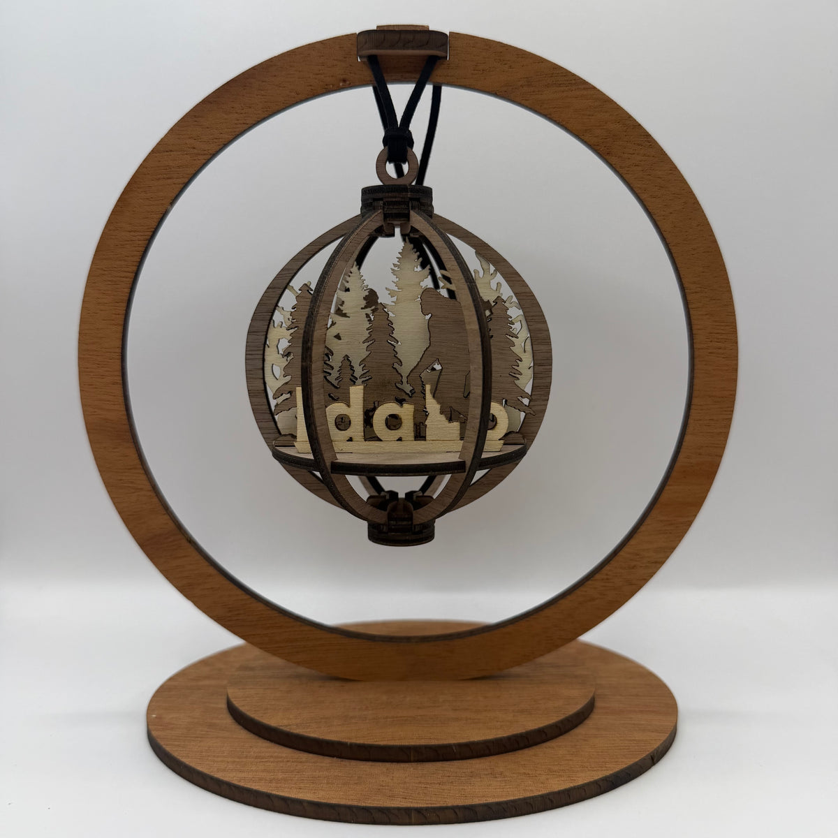 3D Bigfoot Idaho wood ornament shown in a display stand