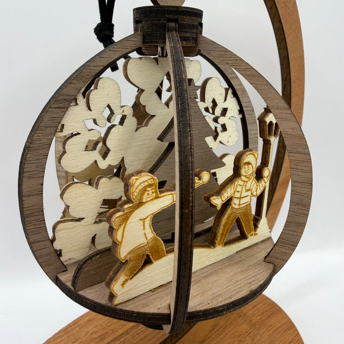 Detail view of the 3D Kids wood ornament design