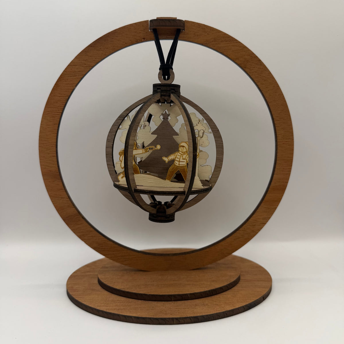 3D Kids wood ornament shown in a display stand