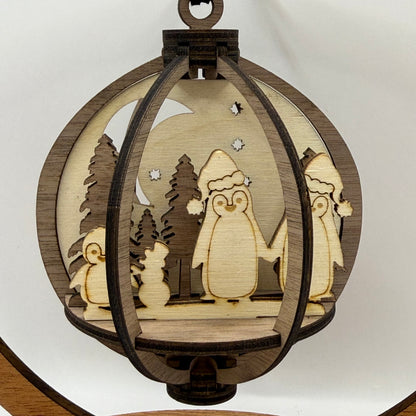 Close-up of the 3D Penguins Family wood ornament