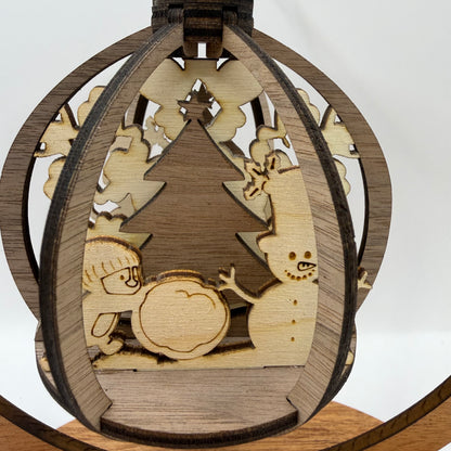 Close-up of the 3D Snowman and Penguin wood ornament