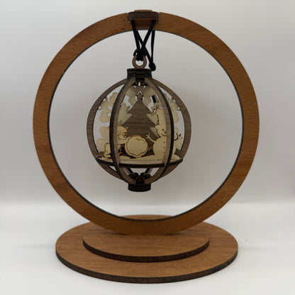 3D Snowman and Penguin wood ornament shown in a display stand
