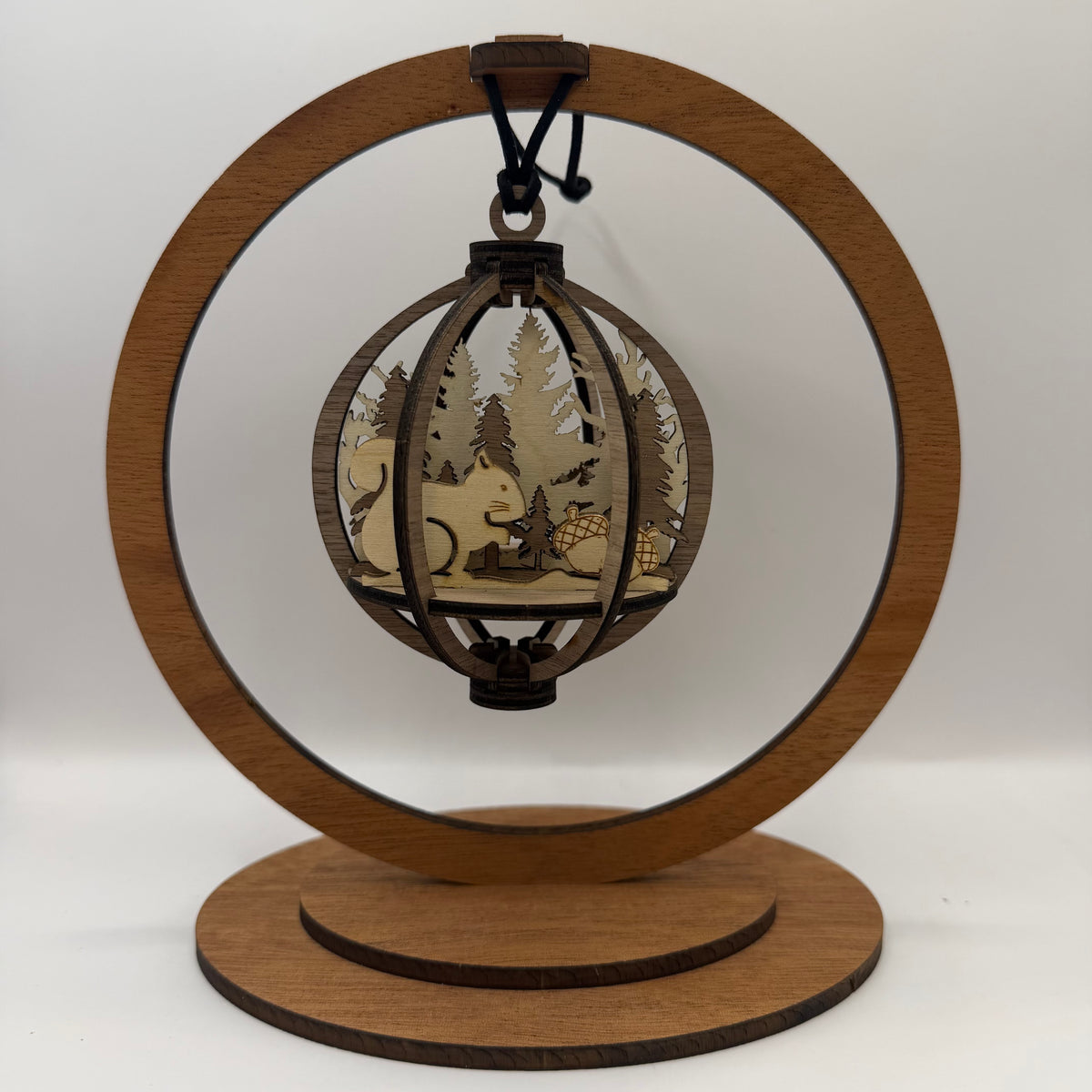 3D Squirrel wood ornament shown in a display stand