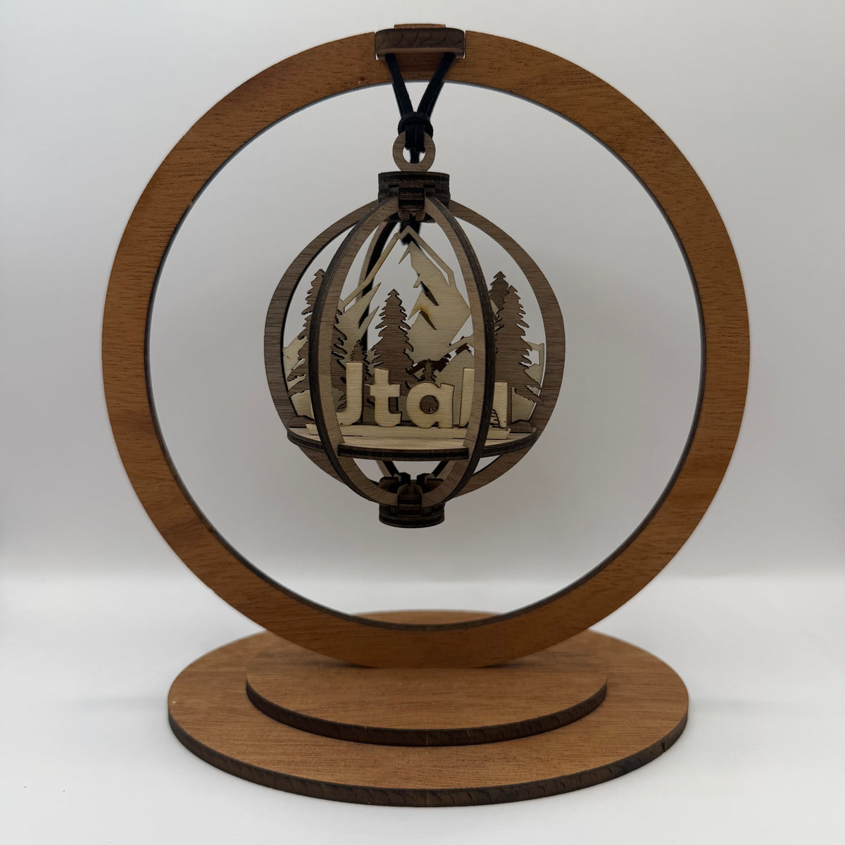 3D Utah wood ornament shown in a display stand