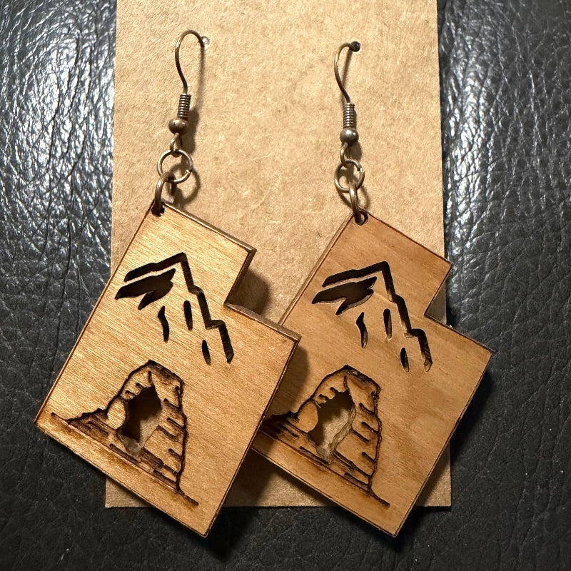 Utah shaped earrings with engraved arch and cut out mountain in cherry wood
