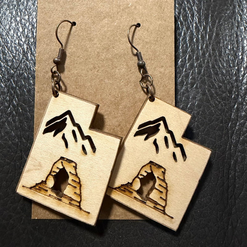 Utah shaped earrings with engraved arch and cut out mountain in maple wood