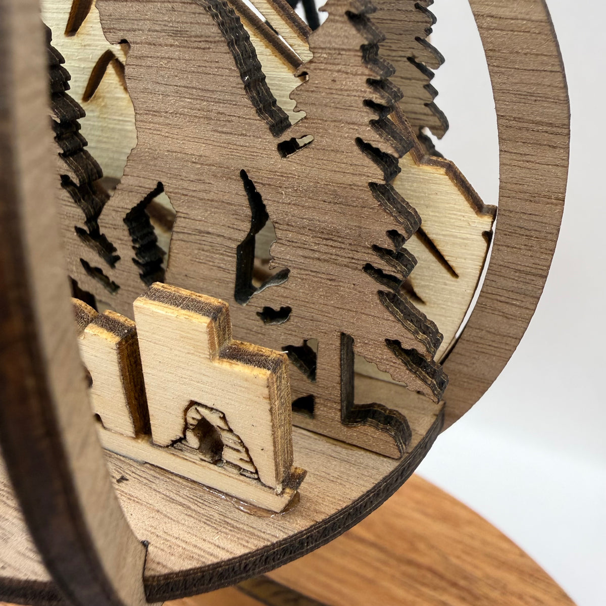 Close-up detail of the 3D Bigfoot Utah wood ornament design