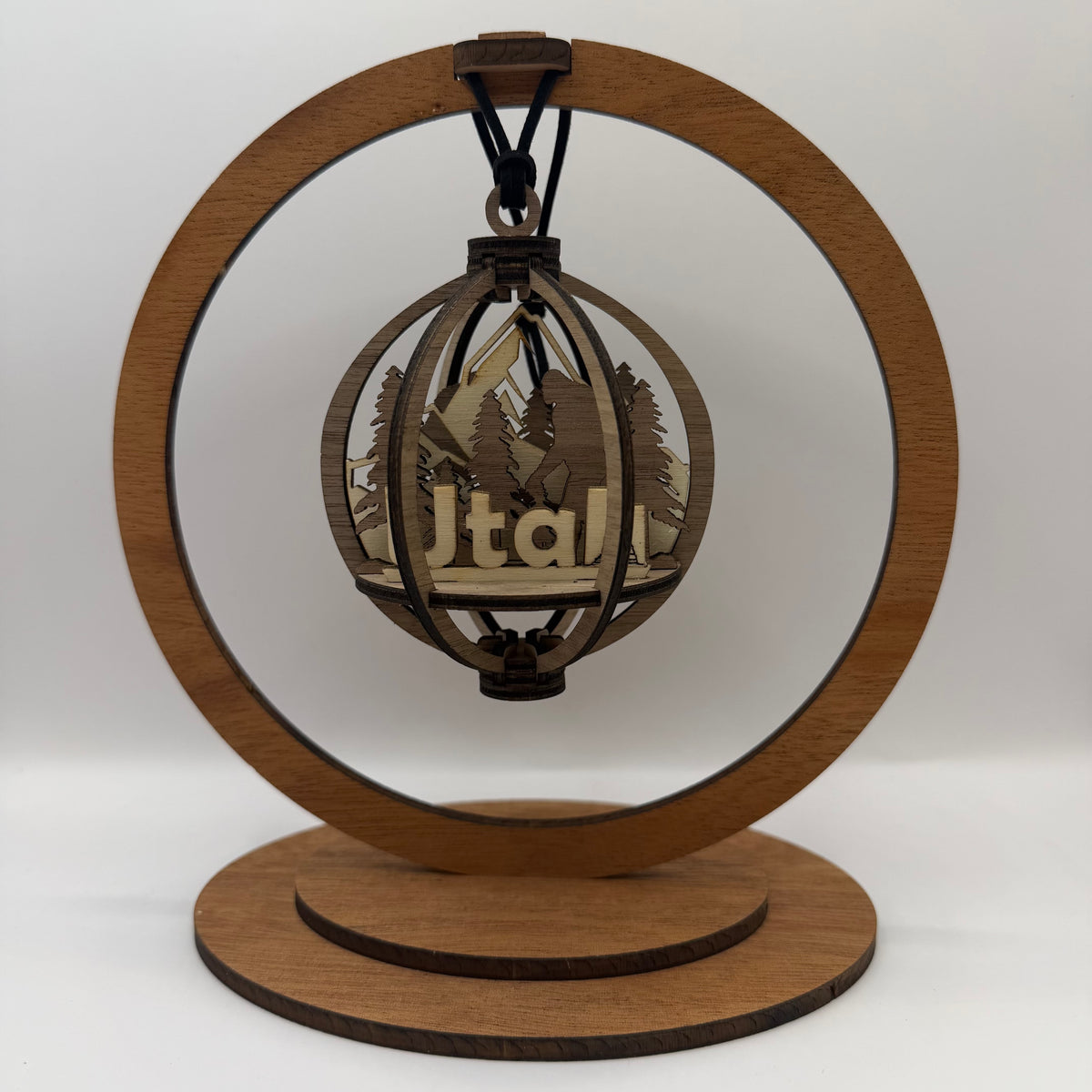 3D Bigfoot Utah wood ornament shown in a display stand