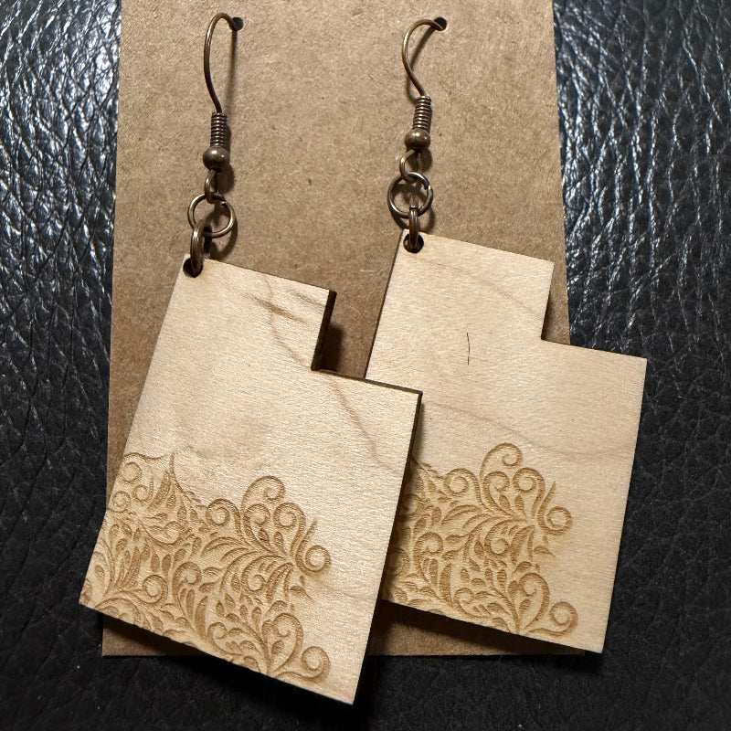 Utah shaped earrings with engraved filigree in Maple wood