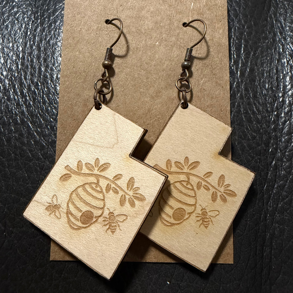 Utah shaped earrings with engraved beehive in maple wood