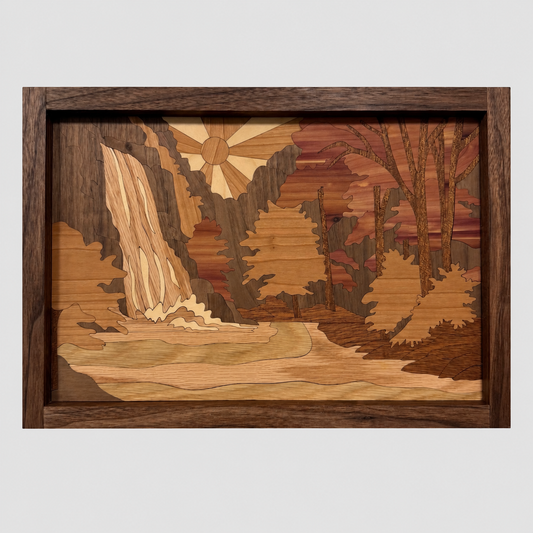 Waterfall wood inlay wall art with a sun, forest, rocks, and a waterfall flowing into a river, in a solid walnut frame