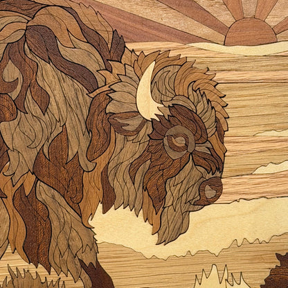 Intricately carved wooden wall art featuring a detailed side profile of a bison with layered wood panels in various shades of brown and beige, set against a stylized desert landscape with a rising sun.