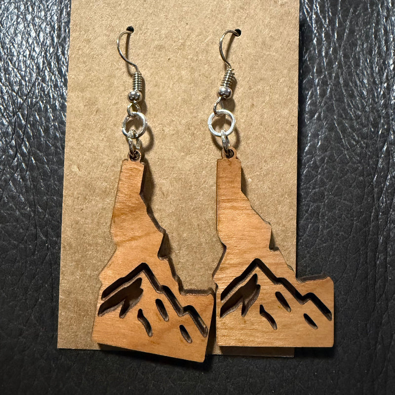 Idaho earrings shown in walnut wood