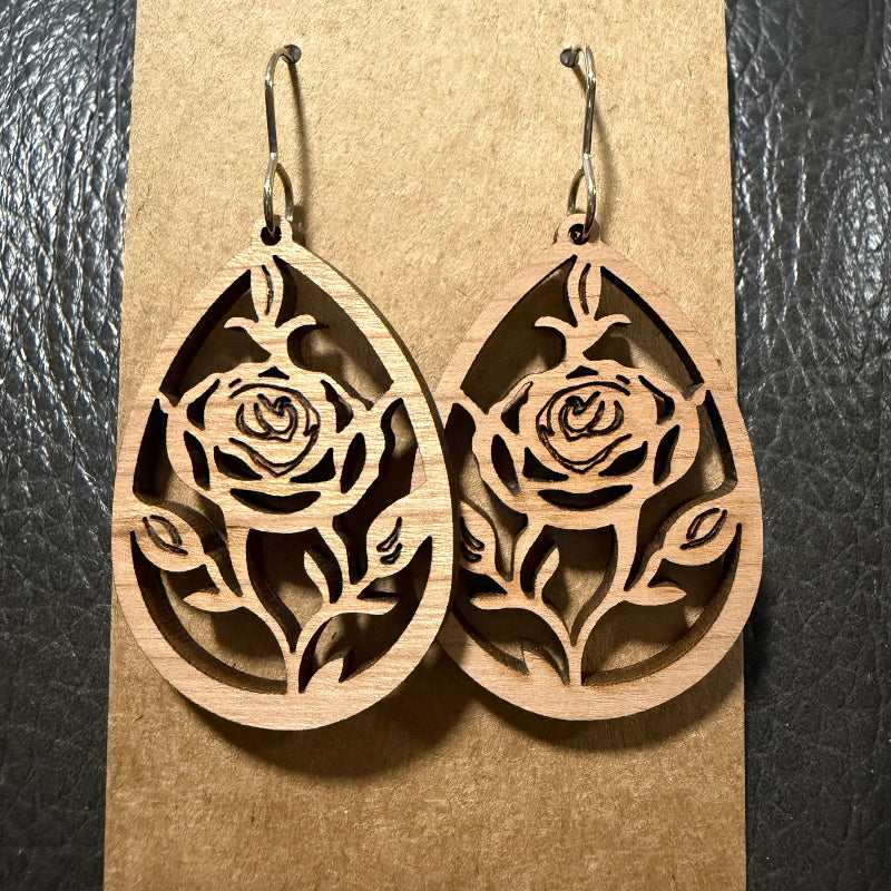Close-up detail of rose cut wood earring design
