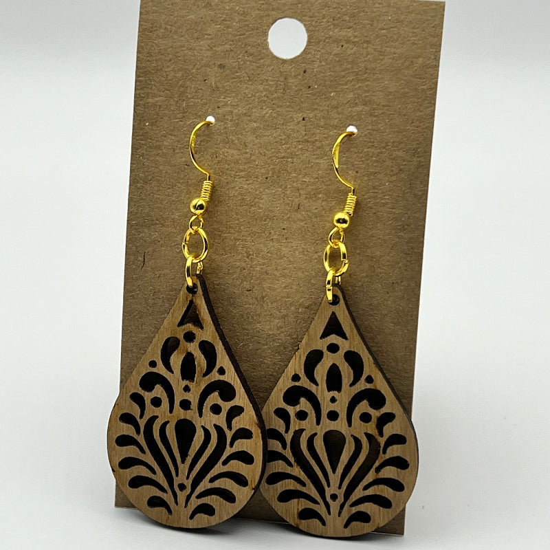 Close-up of teardrop wood earring showing wood grain