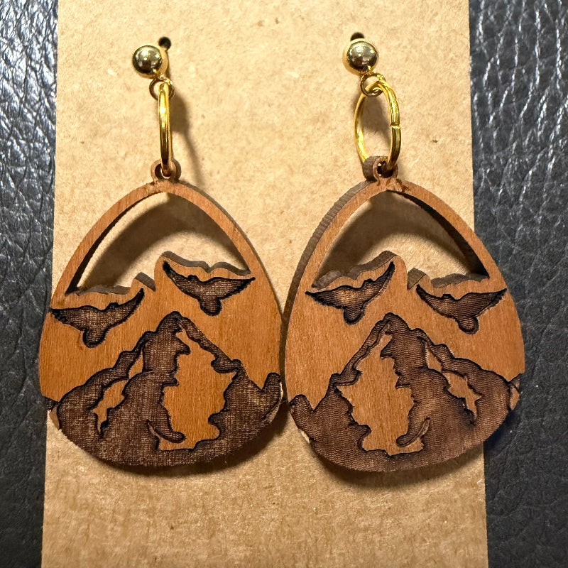 Close-up detail of teardrop mountain wood earring design