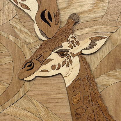 A close-up of a wooden giraffe head mosaic artwork, crafted from natural wood tones with detailed facial features and patterned wood inlay.