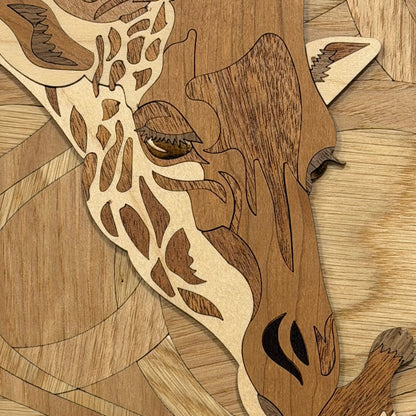 Intricately carved wooden giraffe wall art featuring a large and small giraffe head design layered over abstract curved wood patterns.