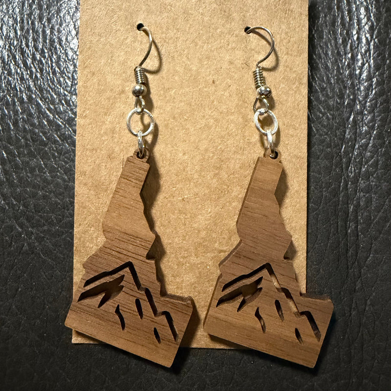 Idaho earrings shown in mahogany wood