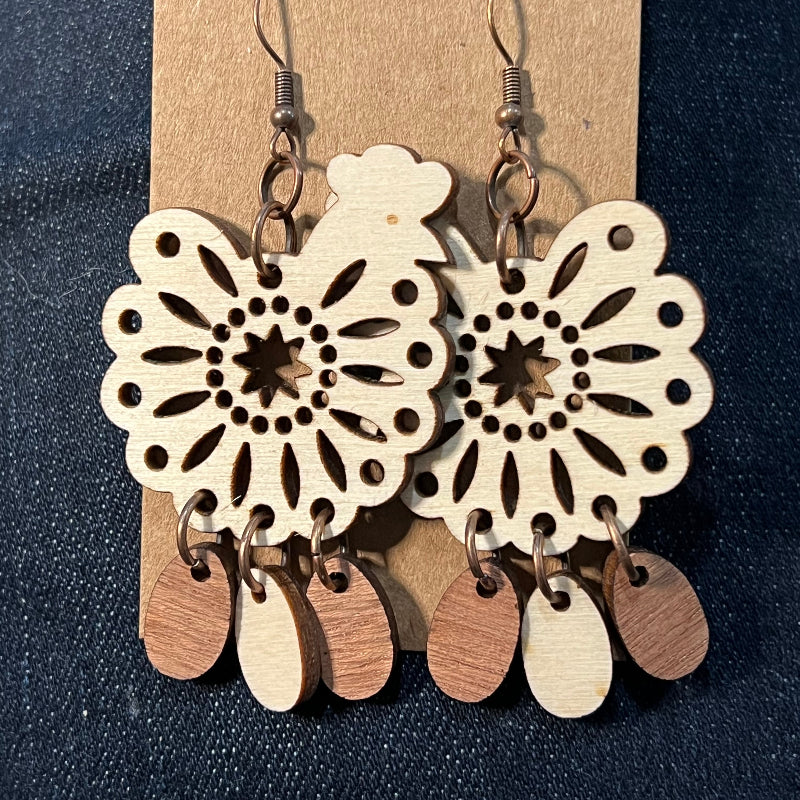 Chicken earrings shown from a different angle