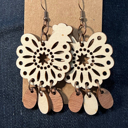 Chicken earrings shown from a different angle