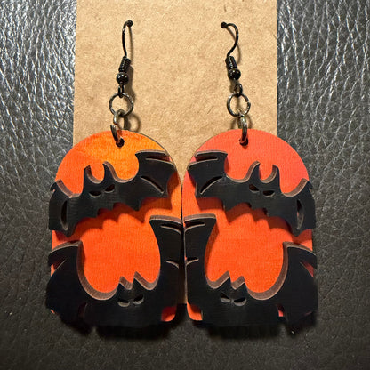 Tombstone with bats earrings shown from another angle
